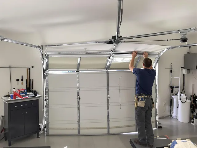 Wickliffe Garage Door Repair specialist performing precise section replacement on Wickliffe garage door